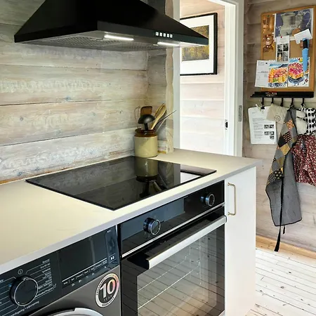 Log With View Of Meadow And Sea