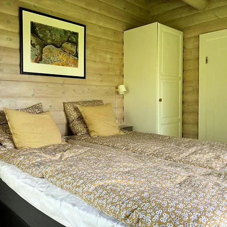 Log With View Of Meadow And Sea