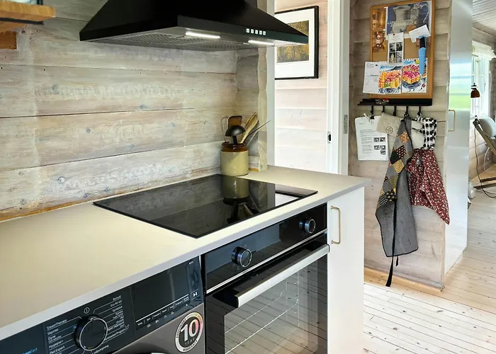 Log With View Of Meadow And Sea