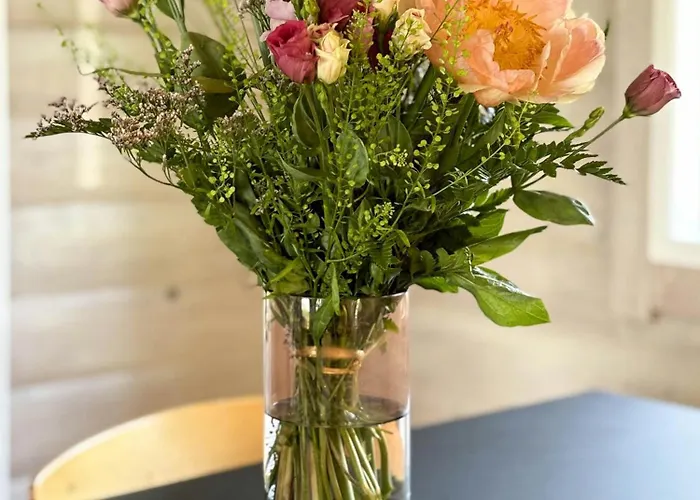 Log With View Of Meadow And Sea