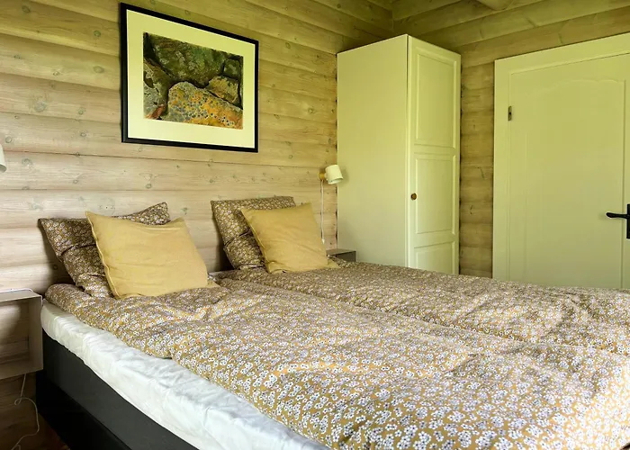 Log With View Of Meadow And Sea