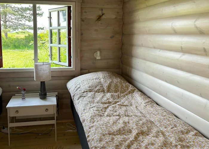 Log With View Of Meadow And Sea Feriehus